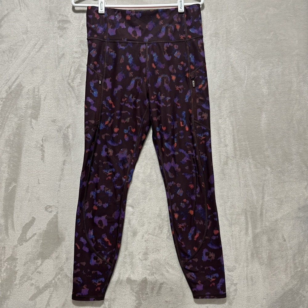 Athleta Rainer Leopard Tight Women's M Adjustable Drawstring Zip Side Pockets‎